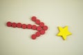 Red arrow point to yellow star shape