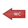 Red arrow. Arrow pointing to the left with the inscription wc. Wooden pointer in the shape of an arrow isolated on a white Royalty Free Stock Photo