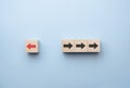 Red arrow print screen on wooden block change direction from right to left which differ from black arrows , Business and