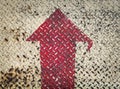 Red Arrow Signs on grungy old weathered metal diamond plate Royalty Free Stock Photo