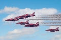 Red Arrows aerobatics display team flying in formation at an airshow at Bournemouth, Dorset, UK Royalty Free Stock Photo