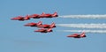 Red arrows in coloured smoke Royalty Free Stock Photo