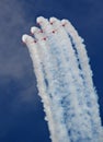 Red arrows and contrails Royalty Free Stock Photo