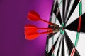 Red arrows hitting target on dart board Royalty Free Stock Photo