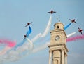 Red arrows over clock tower Royalty Free Stock Photo