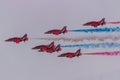 Red Arrows in formation with coloured smoke. Royalty Free Stock Photo