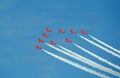 Red arrows smoking contrail stunts Royalty Free Stock Photo