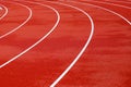 Red artificial running track with white round lines, treadmill rubber texture