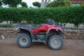 Red ATV in the park. Dahab, South Sinai Governorate, Egypt Royalty Free Stock Photo