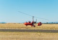 Red autogiro taking off Royalty Free Stock Photo