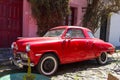 Red automobile on one of the cobblestone streets, in the city of Colonia del Sacramento, Uruguay. It is one of the oldest cities Royalty Free Stock Photo