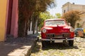 Red automobile on one of the cobblestone streets, in the city of Colonia del Sacramento, Uruguay. It is one of the oldest cities Royalty Free Stock Photo