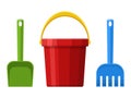 Red baby bucket, spade and rake isolated on white background. Toys set for children sandbox and playground, little