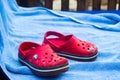 Red baby Crocs on blue town - Vacation theme
