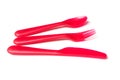 Red baby plastic spoon, fork and knife on white background Royalty Free Stock Photo