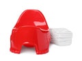 Red baby potty and diapers on white background. Toilet training Royalty Free Stock Photo