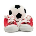 Red baby sneakers with a ball