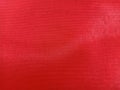 Red background from a fiberglass cloth
