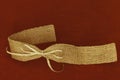Red background with gold beige ribbon underlining text space at top.