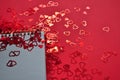 empty notebook between hearts confetti Royalty Free Stock Photo