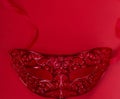 Red background, red mask, red lace mask, red mask for carnival mardi gras,