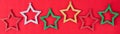 Red background with multicolored star decorations