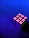 Blue background with rubik object looks some mixed color combination