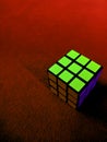 red background with rubik object looks some mixed color combination