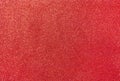 Red background with sequins. Red foamiran with a grainy texture Royalty Free Stock Photo