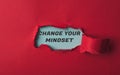 A red background with a torn piece of paper with the words Change Your Mindset Royalty Free Stock Photo