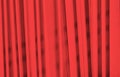 Red background vertical lines. Surface of the wall with a decorative red plaster. Royalty Free Stock Photo