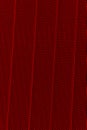 Red background of wavy metallic grid with holes. Metal mesh as back. Perforated metal Royalty Free Stock Photo