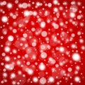 Red background with white falling snow design or bright blurred bokeh lights Royalty Free Stock Photo