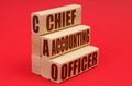 On a red background, wooden blocks with the inscription - Chief Accounting Officer