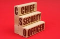 On a red background, wooden blocks with the inscription - Chief Security Officer
