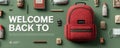Red backpack surrounded by school supplies arranged against green backdrop Royalty Free Stock Photo