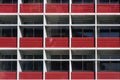 Red Balconies of Modern Multistorey Building. Fragment of Facade.