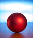 Red ball against blue background Royalty Free Stock Photo