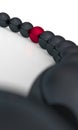 Red ball among black ones Royalty Free Stock Photo
