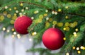 Red ball on christmas tree and defocused lights Royalty Free Stock Photo