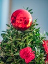 Ball and flower on a small Christmas tree