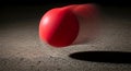 Red ball in motion on textured surface Royalty Free Stock Photo