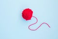 Red ball of woolen thread on light background Royalty Free Stock Photo