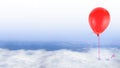 Red balloon on blue sky with white clouds Royalty Free Stock Photo