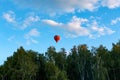 Red balloon flies over the blue clear sky Royalty Free Stock Photo