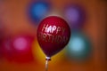 Red balloon with the inscription happy birthday flies up