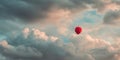 Red Balloon Soaring Through Dreamlike Cloudscape A Captivating Aerial View Royalty Free Stock Photo