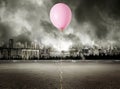 Red balloon on stormy gray background