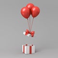 Red balloons lifting up gift box lid open or opening white present box with red ribbon bow on gray background with shadow Royalty Free Stock Photo