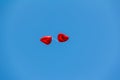 Red balloons in the shape of a heart in blue sky Royalty Free Stock Photo